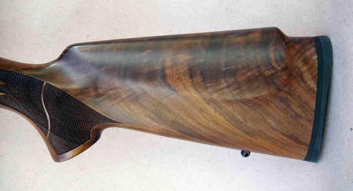 The rifle is fitted with attractive select grade walnut and features a cheekpiece.